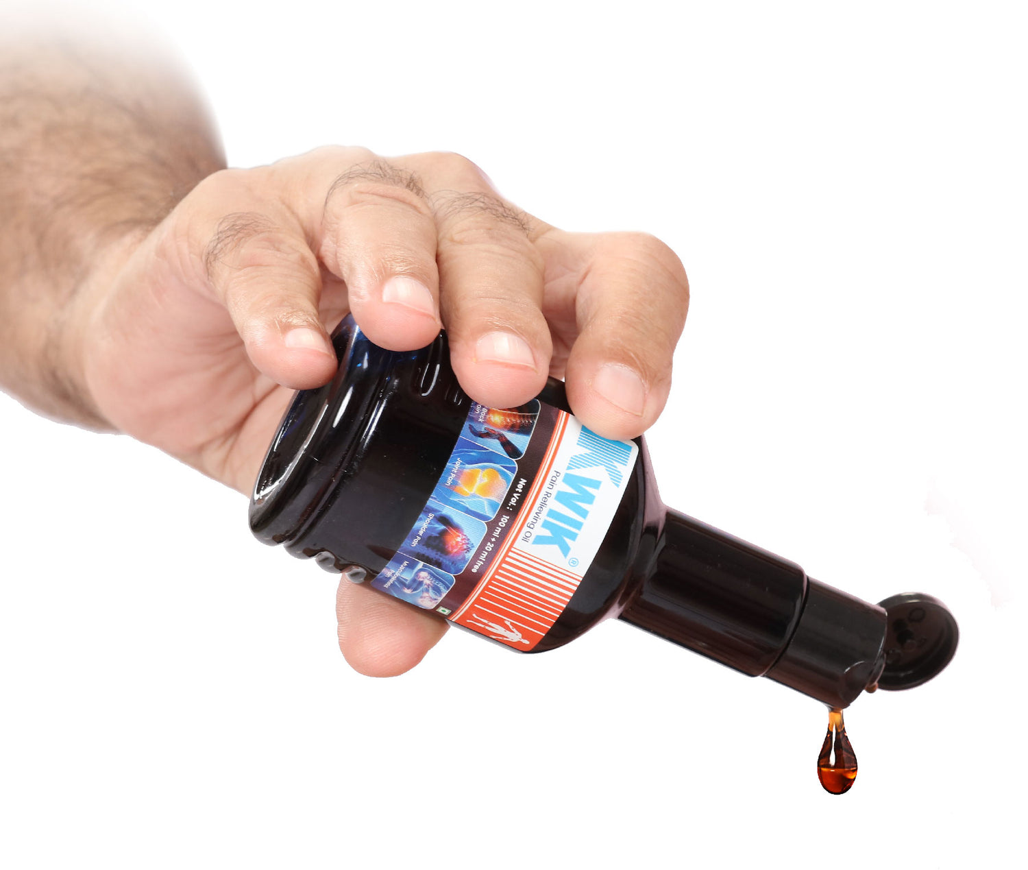 A person's hand pouring Kwik Oil on a white background